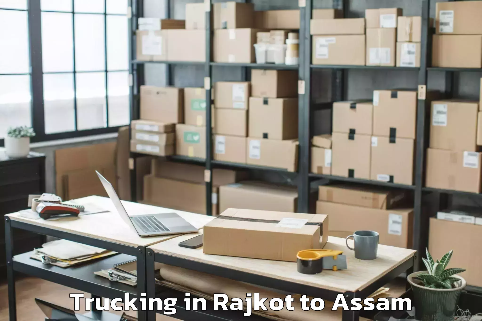 Book Rajkot to Behali Trucking Online